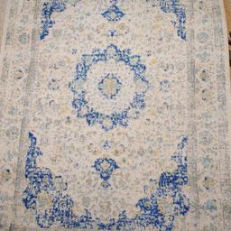 Used a couple of times. bought for £150 at the time. selling as no longer used. come in original packaging of bag and box.Made by Benuta. Measures 120 x 170cm (4ft x 6ft) Also no damage to the rug,no holes etc. The look is the original look if rug in pictures.genuine buyers please.selling at a strap price as want it gone ASAP. open to decent offers also. Thanks