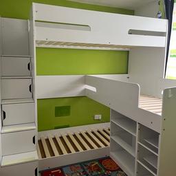 Dimensions: L:236cm, Width without Middle Bunk:120cm, Width Including Middle Bunk:210cm, H:205.8cm

A modern twist on the L Shape bunk bed, the Samual allows for a higher set top bunk and a floor bottom bunk, to give extra space in between to perfectly slot a third bunk, which is ideal for triplets, twins or those needing an extra bed for sleepovers and guest.

The Samuel Staircase Triple Bunk Bed includes plenty of storage and a handy drawer unit has been added underneath the middle bunk, which doubles as a ladder to access the middle bunk along with two deep storage drawers and a handy shelf. A staircase ladder to access the top bunk has been fitted with integrated cupboards in each step to give you extra storage space!

All in good order, no breakages. Mattresses not included. Dismantled.