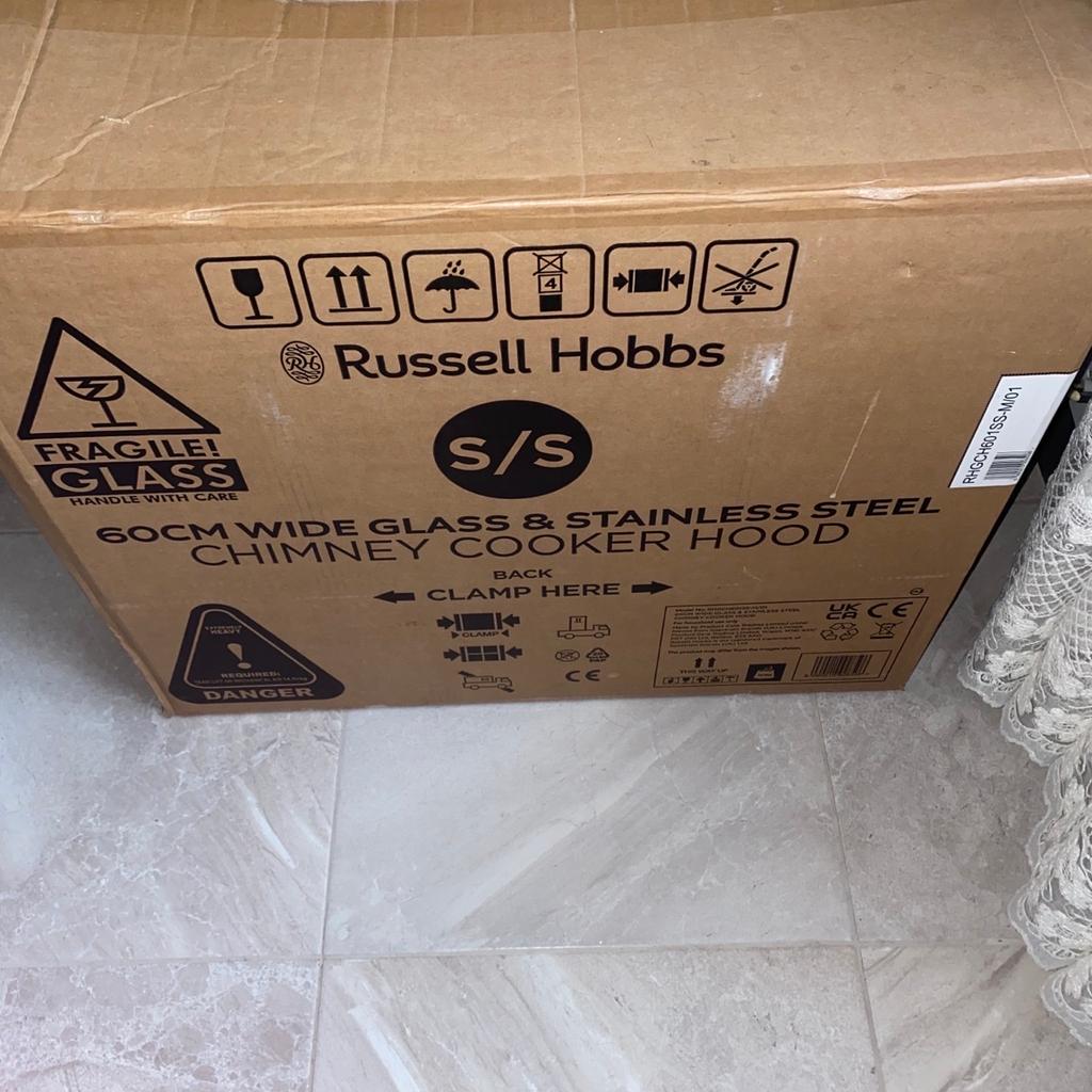 Brand new chimney cooker hood. The box has been opened, however the items have not been taken out and it has not been used at all. Please see photos for reference. Happy to drop off this item if you live around NW London. However if not, then only for collection. Thank you :)

Say goodbye to excess heat and steam while you're cooking with the Russell Hobbs RHGCH601SS Chimney Cooker Hood. It can extract and recirculate air, with aluminium grease filters that capture airborne grease particles.

Its glass canopy and stylish stainless-steel design will make it an ideal addition to your kitchen. Plus, with 3 fan speeds to choose from, you can easily find the ideal setting to suit your needs.

The 2 LED lights also help to illuminate your cooking, so you'll be able to clearly see what you're doing while you prepare delicious meals for you and your family.