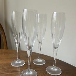 Beautiful set of 4 crystal champagne flutes. These have been sat in a display cabinet for years so could do with a clean but are in great condition. Ideal as a new set of glassware for parties or for a bar. 

Open to reasonable offers. These were my grandads so I would like them to go to a home where they can be appreciated.