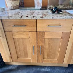 Kitchen cabinets solid oak with drawers,cupboards, and tall side storage with Granite worktop and plinth.