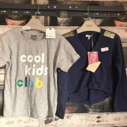 THIS IS FOR A BUNDLE OF GIRLS CLOTHES

1 X NAVY CARDIGAN FROM CONFETTI - DESIGNER - BUTTONS DOWN THE FRONT WITH GOLD SEQUIENCE ON SHOULDERS
1 X GREY T-SHIRT FROM NEXT WITH COOL KID THEME

PLEASE SEE PHOTO