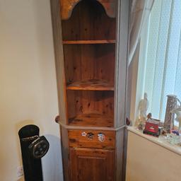 large corner display unit.
has 3 shelves 1 drawer and 1 small cupboard.
fantastic condition - was painted half in grey but never finished.