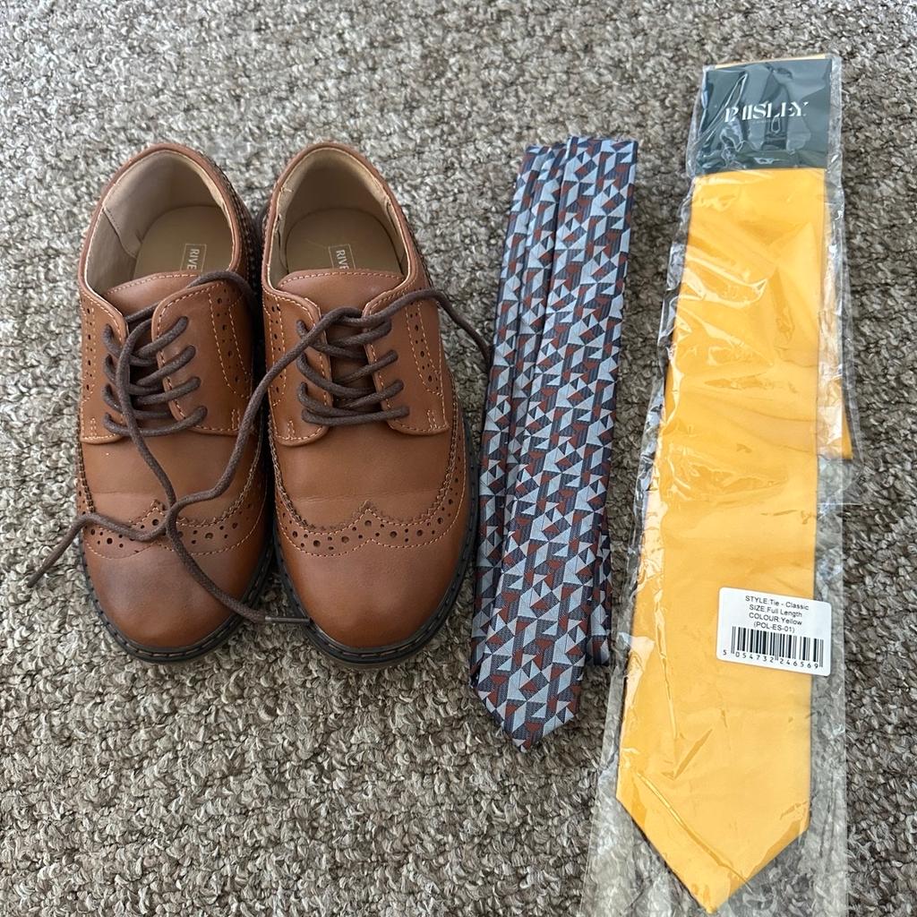 Next suit Size 8-9 boys. Comes with trousers, shirt, waist coat & jacket. Original tie included as well as another that we used. Shoes are a size 13 river island. Only worn for 2 hours.