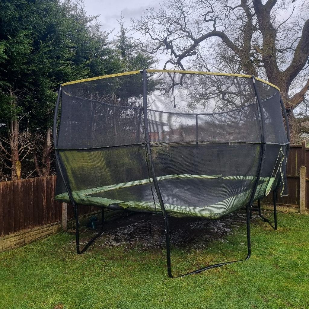 10 x 14 trampoline, weathered but in good condition. Surround netting still good and sturdy with one or two bilts missing from the double bolted bars. Jet washed clean after being out during winter. pick up only