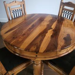 solid heavy round table and 4 chairs. Indian wood with jali iron work and detailing. well looked after, but with some varnish peeling now. but doesn't affthe use of the table. please see photos.

very heavy, so will need 2 people to carry and a van.
from a smoke free household

collection from ST20 0RL. no delivery.