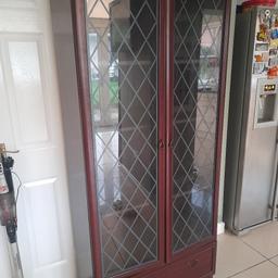 dark wood glass cabinet as one or two flaws but not to noticeable.....31 " wide  16" deep and 6ft high