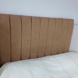 A smart tall headboard that sits on the floor  and fitted to the base of a divan .  Only  had a couple of months in spare room.  Selling due to a move.   paid £240.  Can deliver locally.