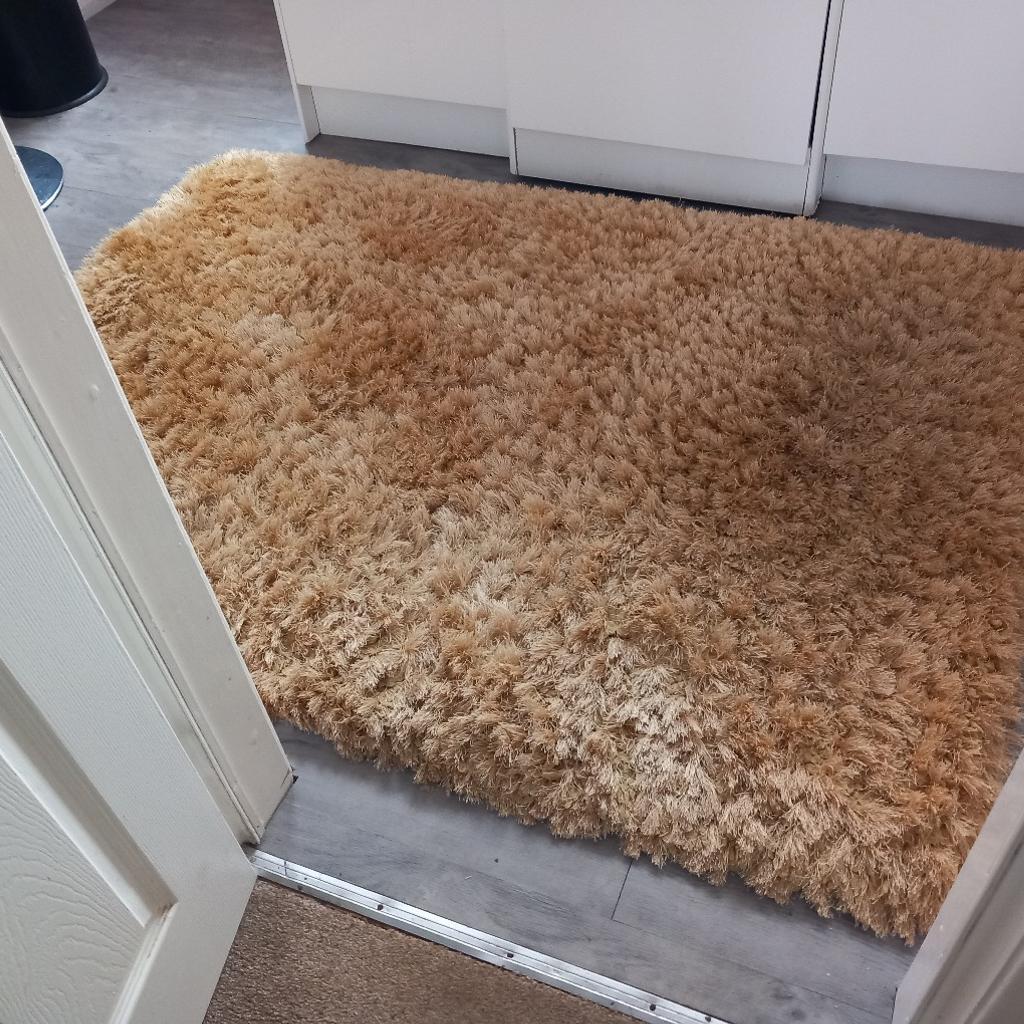 Pearl design. large heavy mustard coloured thick rug.100% polyster from flair rugs.expensive quality.size 170cm x120cm.excellent condition.pet free.