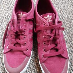 A Pair of ladies Adidas trainers in a deep wine colour ,still in good condition,,Size 7..PayPal or bank transfer or collection only..postage to be paid.