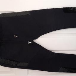 A beautiful pair of straight leg Trousers /Joggers,,Elasticated waist with draw strings which have metal stoppers,, panels down the side of the legs..Side pockets and back pocket and ribbed bottoms, Sold in Harrods and other expensive shops,RRP PRICE IS £500 . plus .Size 14.never worn.. Inside leg 28 inches.. Balmain Paris clothing is one of the best designs,,please look at there website..PayPal or bank transfer or collection only, postage will be covered.