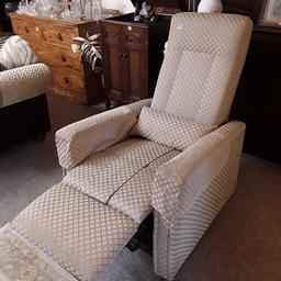 This gorgeous British made olive green satin damask patterned fabric high-backed armchair is in excellent like-new condition with not a mark on it! It was originally a rise and recliner but I accidentally chopped the wire in the mechanism when I was trying to rise it and it blew the motor!... I am just selling as a manual reclining arm chair now. There are no levers however, so you just need to push back with your feet to recline. It is on good sturdy wheels too!

29 inches wide 32 inches deep x 46 inches high.

Our second hand furniture mill shop is LOW COST MOVES, at St Paul's trading estate, Copley Mill, off Huddersfield Road, Stalybridge SK15 3DN...Delivery available for an extra charge.

If you are interested in this or any other item, please contact me on 07734 330574, or on the shop 0161 879 9365...Many thanks, Helen.

We are OPEN Monday to Friday from 10 am - 5 pm and Saturday 10 am -  3.30 pm.. CLOSED Sundays. CLOSED Bank Holiday long weekends...