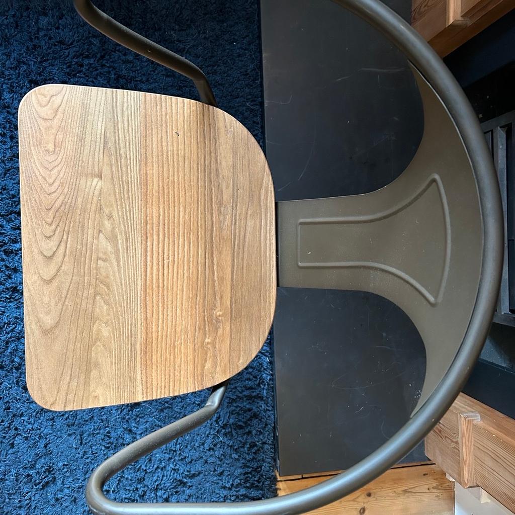 Two identical industrial style bar stools with adjustable heights. Oak wooden seats and metal frames. In great condition, no marks or scratches. Original packaging not available.