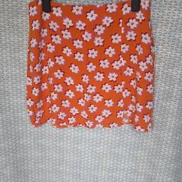 nice orange short summer skirt, approx 15 inch long, size 10 from Primark, good condition, can post for cost