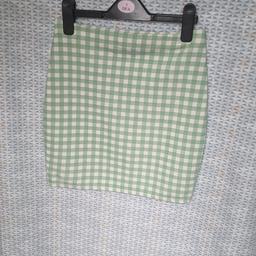 green short skirt, approx 15 inch long, tube type,stretchy waist,size 10 from pretty little thing, good condition, can post for cost