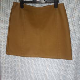 nice tan colour faux leather skirt approx 16 inch long,size 12 from Primark, good condition, can post for cost