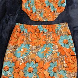 katch me skirt and corset style top co-ord set,size 10,skirt length approx 15 inch, adjustable shoulder straps on top,worn once,great condition , free delivery with asking price 