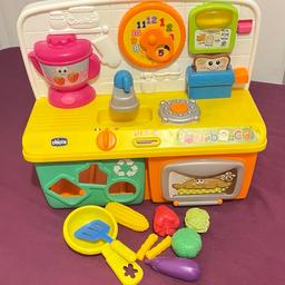 Interactive toy kitchen. Good for early learning. Few fruits are missing. In good condition. Needs batteries.