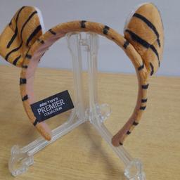 Tiger-Ears Headband

Postage possible at buyer's expense with payment by PayPal please so buyer protection will apply
