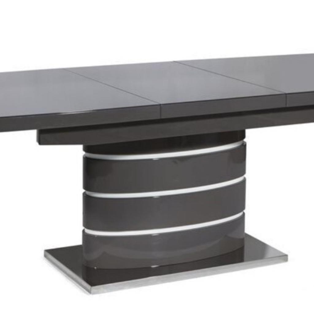 Create a stylish statement in your home with the Rimini extendable grey dining table with console unit.

Items has Stainless steel base and 4mm tempered glass top. Each piece is complete with a high gloss finish.

Dining table is complete with six dining chairs.

The pieces are already assembled however they are very heavy and may need 2 people.
DIMENSIONS
Dining Table/ 160 X 90 X 75 Cm
Extending dining table has width of 215cm when fully extended.

Items can be purchased as a pair or individually.

Rimini Console Table £100
Extendable Grey Dining Table and 6 chairs £550

Or both pieces for £600