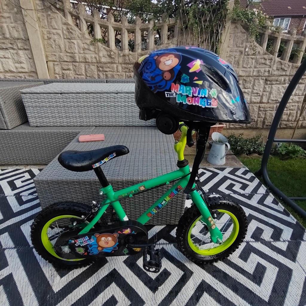 Child's Marvin the Monkey bicycle and helmet, kept inside a shed, pneumatic tyres, helmet was hardly ever worn so looks brand new