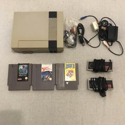 Nintendo nes console 
Super mario 3
Manic mansionz
Isolated warrior 
2 pads and plug wires 
Works great
