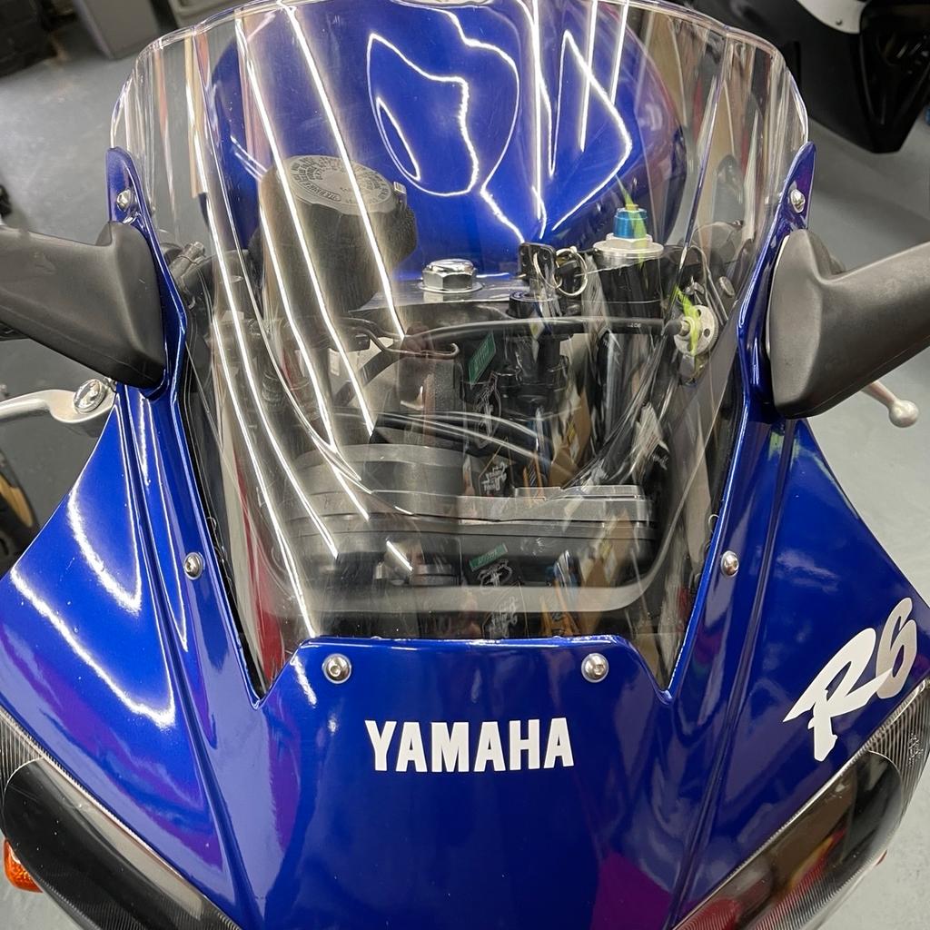 Hi welcome to my auction for my beloved Yamaha or R6 1999 yzf this has only done 9 1/2 thousand miles only 3 owners from new , It runs as sweet as a nut. It has been left in heated dry storage for a few years now not had much use started every few weeks I’m run up to temperature with fresh fuel, could do with a good run out and a bit of TLC but apart from that, it’s a fantastic bike runs and rides like new grab a bargain , I have a new front tire for it also and some other bits . Perfect for investment purposes with low mileage these bikes will only go up in value especially now Yamaha has announced they are stopping making bikes