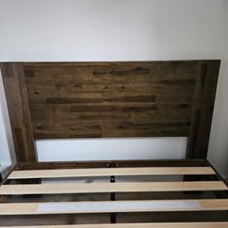Solid wood double bed frame with headboard. Less than 6 months old in excellent condition. Selling due to relocation