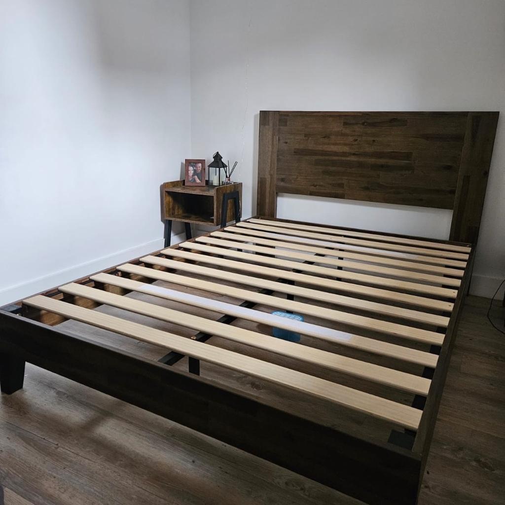 Solid wood double bed frame with headboard. Less than 6 months old in excellent condition. Selling due to relocation