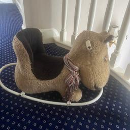 Rocking horse in a coffee colour with a brown seat