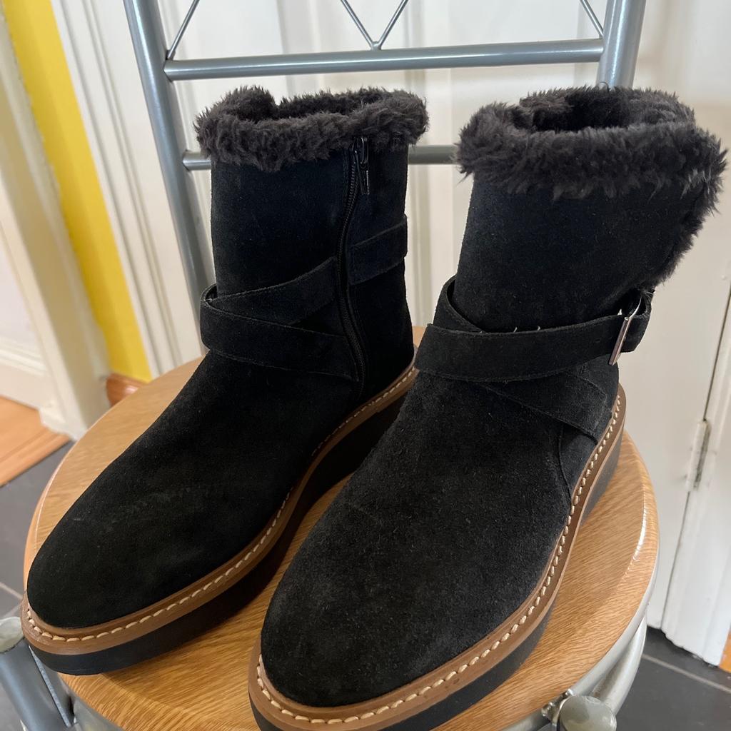 Brand new, black suede leather ankle boots with fur lining, size zip, buckle, and small platform sole, size 4.5 by M&S. Were £50 new.