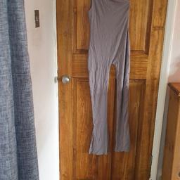 Women's light grey jumpsuit size 6 worn once so like new. From a smoke and pet free home.