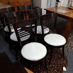 This set of 6 vintage solid dark mahogany dining chairs with a cream pvc seating cover are in fair condition. There are quite a few marks to the wood and there is some damage and marks to the seat cushions on several of them... £40 set of 6. 

16 inches wide x 9.5 inches deep x 33.5 inches high. 

Our second hand furniture mill shop is LOW COST MOVES, at St Paul's trading estate, Copley Mill, off Huddersfield Road, Stalybridge SK15 3DN... Delivery available for an extra charge. 

There are some large metal gates next to St Paul's church... Go through them, bear immediate left and we are at the bottom of the slope, up from the red steps... 

If you are interested in this or any other item, please contact me on 07734 330574, or on the shop 0161 879 9365...Many thanks, Helen. 

We are OPEN Monday to Friday from 10 am - 5 pm and Saturday 10 am - 3.30 pm... CLOSED Sundays. CLOSED Bank Holiday long weekends...