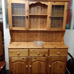 This lovely large solid panelled pine dresser is in good all-round used condition. It comes in two sections... 

54 inches wide x 18 inches deep x 75.5 inches tall.. 

Our second hand furniture mill shop is LOW COST MOVES, at St Paul's trading estate, Copley Mill, off Huddersfield Road, Stalybridge SK15 3DN... Delivery available for an extra charge. 

There are some large metal gates next to St Paul's church... Go through them, bear immediate left and we are at the bottom of the slope, up from the red steps... 

If you are interested in this or any other item, please contact me on 07734 330574, or on the shop 0161 879 9365...Many thanks, Helen. 

We are OPEN Monday to Friday from 10 am - 5 pm and Saturday 10 am - 3.30 pm... CLOSED Sundays. CLOSED Bank Holiday long weekends...