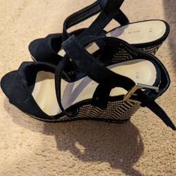 New never used 
a wedge heeled sandal 
patterned sandal