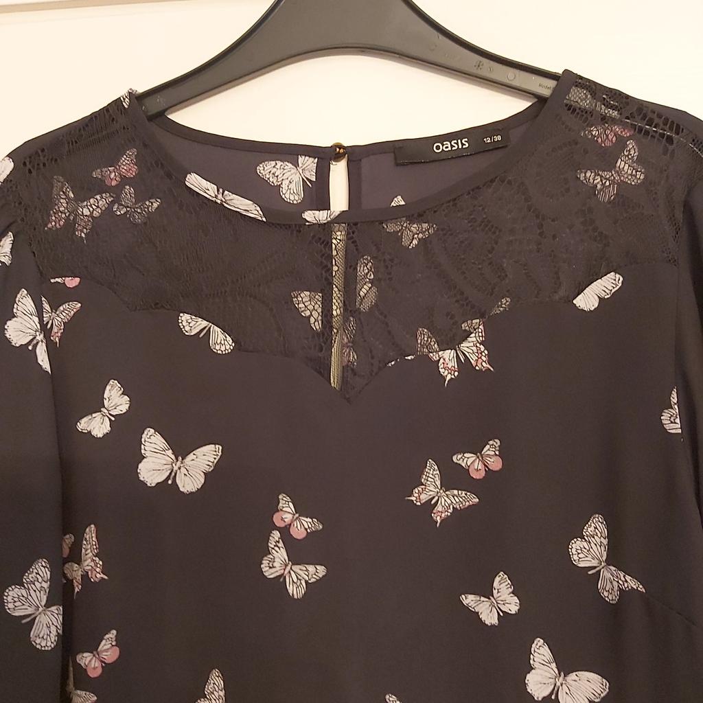 oasis long sleeve very smart with lace on the top & butterflies on size 12 like new collection only
