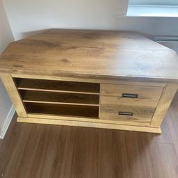 A good solid tv unit . The second pics shows a rough bit but easy replaced with new strip which you can buy anywhere cheap.
