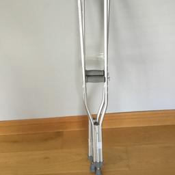 Unused height adjustable under arm crutches.