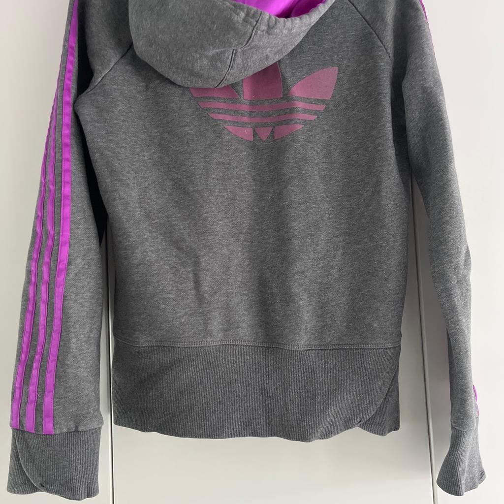 Adidas size 14 , but slim fit so small 14.
Lovely bright purple trim . Excellent condition.