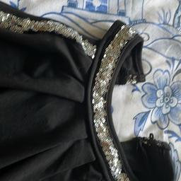 Black halter neck top  size XL but coming up smaller size 14 brand new sequins on neck and round arm