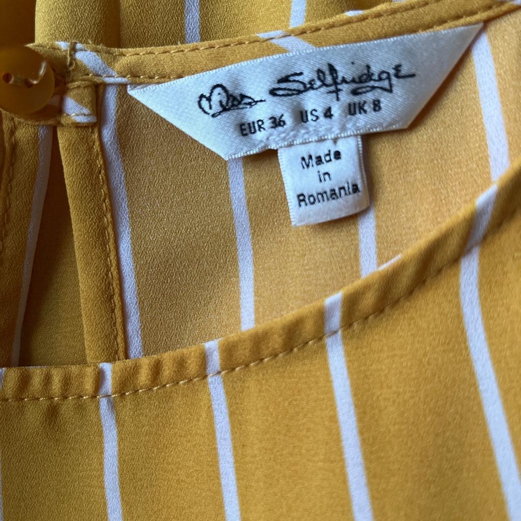 Lovely yellow and white stripe blouse featuring tie front, size 8 by Miss Selfridge
Tags removed but never worn.