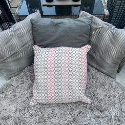 3 grey cushions and a pink and grey. Can sell separate.