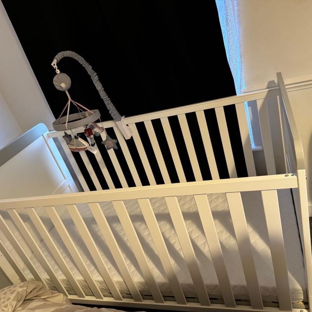 White cot basically brand new my son only slept in the cot couple times mattress is fresh. The cot only has couple scratches due to moving around in my house. It also comes with the changing baby part