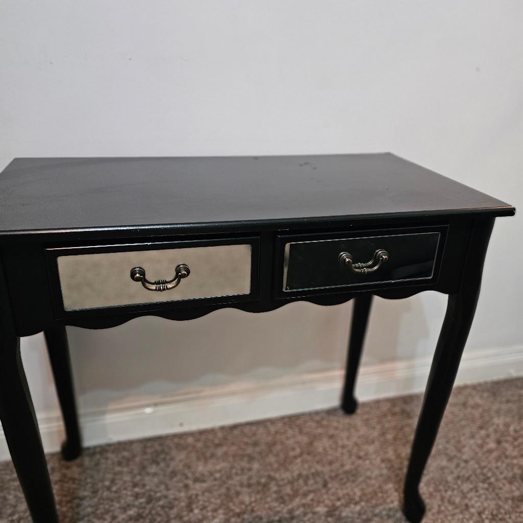 Black console table

2 mirrored draws

Scallop design at the front

Very sturdy

Some sign of ware and tear as shown in the pictures