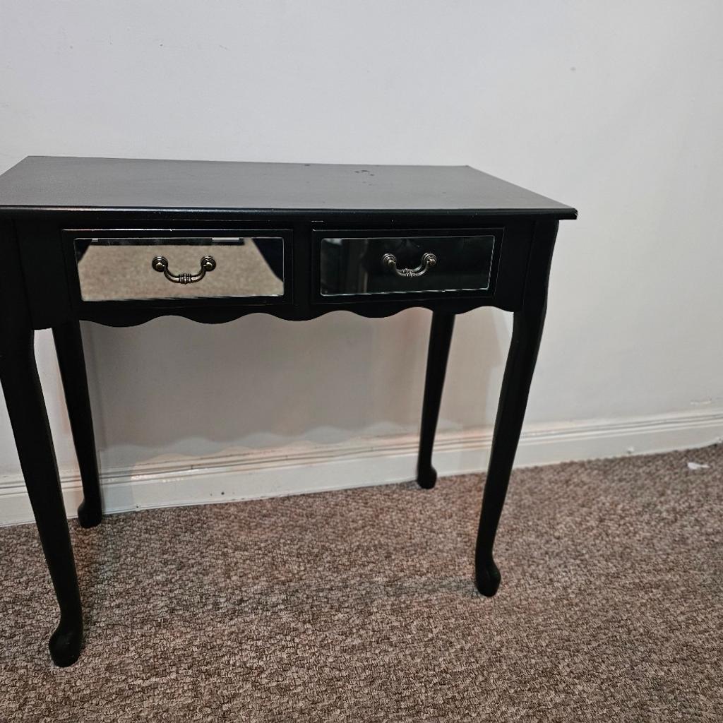 Black console table

2 mirrored draws

Scallop design at the front

Very sturdy

Some sign of ware and tear as shown in the pictures