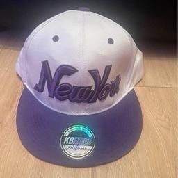 Brand new, Never been worn. Amazing condition. A purple and white New York kbethos cap. Collection Prestwich.