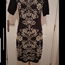 Stunning Black/Gold Knitted Dress
Metallic Sheen
Lovely N Stretchy 
Short Sleeve 
Excellent Quality  & Condition

🌟🌟 Plz see all photos 🌟🌟 

👚👛🧥 Please take a look at my other listings 👖👙👗

👍👍Thanks for looking👍👍
🛍👛 Happy Shopping 🛍