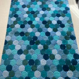 This is a lovely wool rug that has hardly been used. Size is 145cmx225cm. On sale for £80 or ONO.