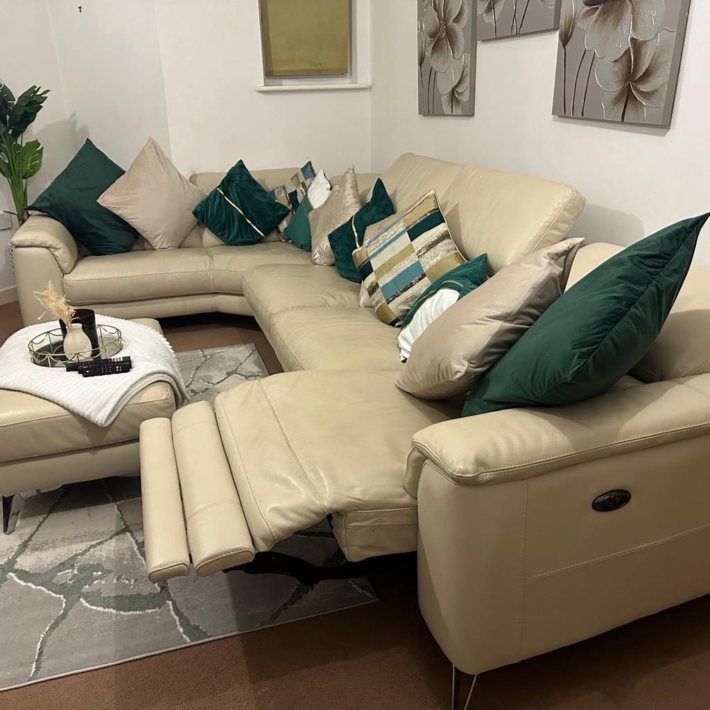Up for sale I have a cream/beige leather sofa with matching footstool. Left end seat reclines. Silver legs. Purchased from DFS for £3597. With 1 extra year left of Sofa Care for any damages to the sofa. More than welcome to answer any questions.