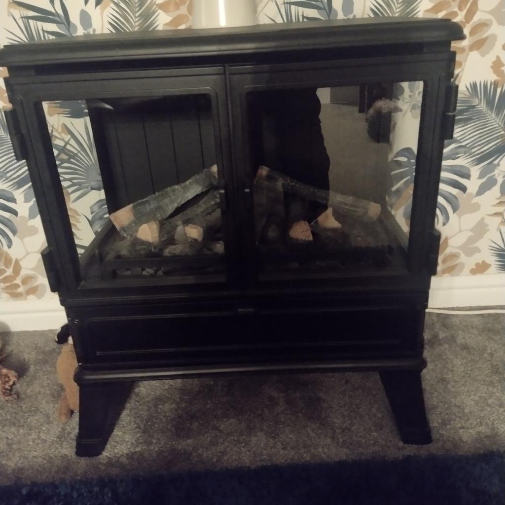 large dimplex electric fire, heater has 2 heat settings which works fine, and fire glow works when switched on. should have a flame effect but needs a new part. cost nearly a thousand when new